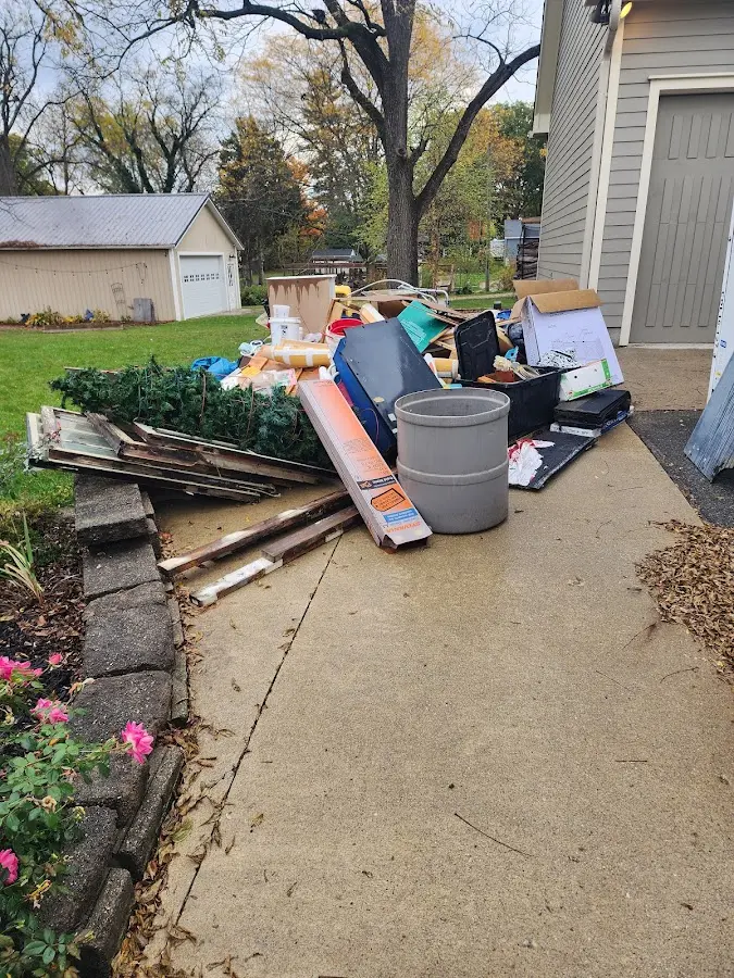 Dumpster being loaded with debris for Demolition Dumpster Rental in Harrietstown
